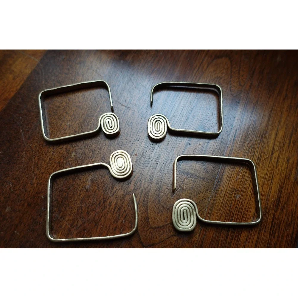 set of 4 Vintage napkin rings metal brass with swirl rectangular design